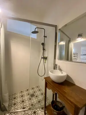 a bathroom with a sink and a shower at Joli appartement niçois en bord de mer in Nice