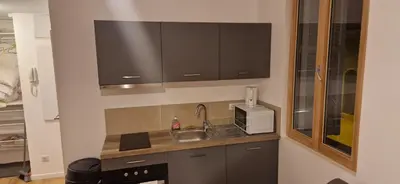 a kitchen with a sink and a microwave at Ville nice in Nice