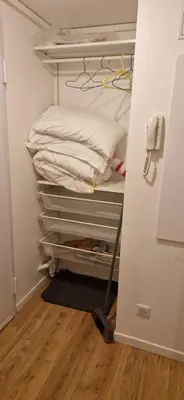 a room with a closet with a bed and a broom at Ville nice in Nice
