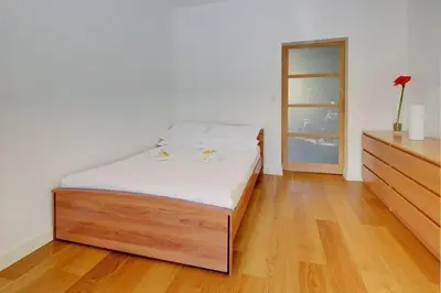 a bedroom with a bed and a dresser at MyrAzur Carre d'Or in Nice