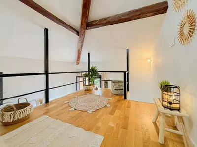 an open living room with wooden floors and white walls at Potiers - parking, Wifi, 2pers in Nice