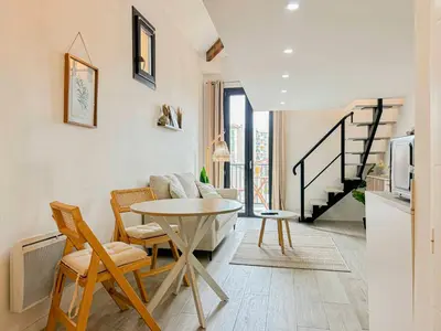 a kitchen and living room with a table and chairs at Potiers - parking, Wifi, 2pers in Nice