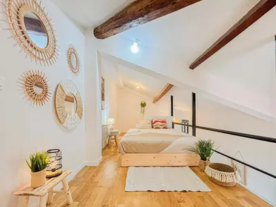a bedroom with white walls and a bed in a room at Potiers - parking, Wifi, 2pers in Nice