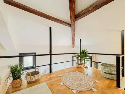 an open living room with a table and potted plants at Potiers - parking, Wifi, 2pers in Nice