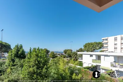 a view from the balcony of a building at Air-conditioned apartment facing the port of Saint Laurent with 2 bedrooms in Saint-Laurent-du-Var