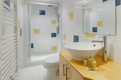 a bathroom with a sink and a toilet and a shower at Rue St Gaetan location old town in Nice
