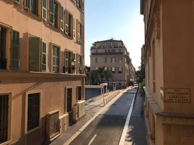 an empty street in a city with buildings at Rue St Gaetan location old town in Nice