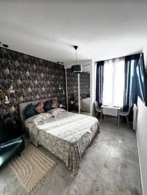 a bedroom with a large bed in a room at Studio en bord de mer, Plage 20m, Clim in Cagnes-sur-Mer