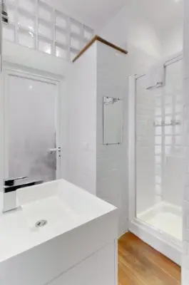 a white bathroom with a sink and a shower at Rue Fodere location Port area in Nice