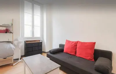 a bathroom with a white toilet and a sink at Studio confortable à Nice - 19 m² avec vue sur la ville in Nice