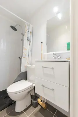 a living room with a couch and a flat screen tv at Studio confortable à Nice - 19 m² avec vue sur la ville in Nice