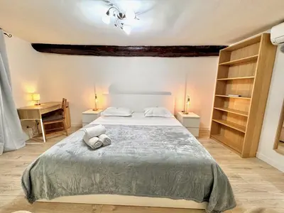 a bedroom with a bed with two towels on it at ApartHotel Riviera - ANGLE DROITE - Old town Promenade des Anglais in Nice