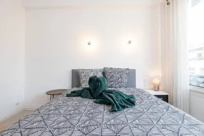 a stuffed animal on a bed in a bedroom at Royal Riviera in Nice