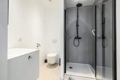 a bathroom with a shower and a toilet and a sink at Royal Riviera in Nice