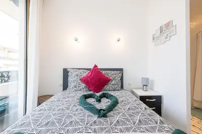 a bedroom with a heart shaped pillow on a bed at Royal Riviera in Nice