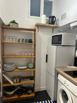 a kitchen with a white refrigerator and a microwave at Vieux Nice in Nice