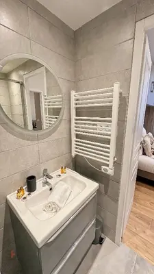 a bathroom with a sink and a mirror at Le Petit Saint Barth- Easy Home Booking in Nice