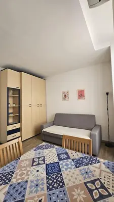 a room with a bedroom with a bed and a couch at Studio Nice Centre - Climatisation in Nice