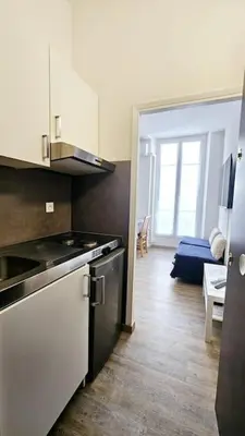 a kitchen with a sink and a stove top oven at Studio Nice Centre - Climatisation in Nice