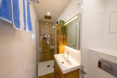 a bathroom with a sink and a shower at 06K1 - Front of the sea-renovated-terraceparking in Saint-Laurent-du-Var