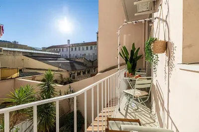a balcony with stairs and plants on a building at Charming Apt Nice Port Place du Pin with Balcony in Nice