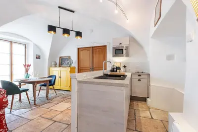 a kitchen with a sink and a table at 1 SALEYA LOT 2 - Au coeur du Vieux Nice - 1min de la Plage in Nice