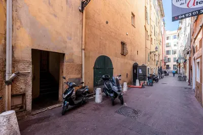 a couple of motorcycles parked next to a building at 1 SALEYA LOT 2 - Au coeur du Vieux Nice - 1min de la Plage in Nice