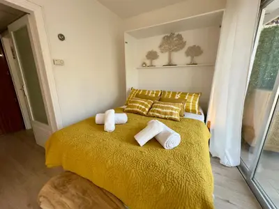 a bedroom with a bed with towels on it at L'Éclat Safran - Royal Luxembourg in Nice