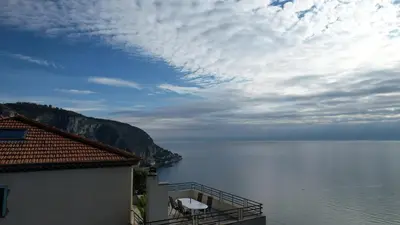 a view of a body of water from a building at Villa Moana in Èze