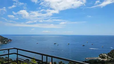 a view of a large body of water with boats at Villa Moana in Èze