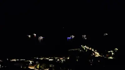 a night view of a city with tall buildings at Villa Moana in Èze