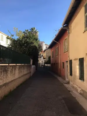 an empty alley way in an alley between two buildings at Le Village - cosy flat 5 min walk away from sea in Nice