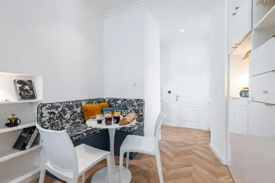 a small dining room with a table and chairs at 37 MASSENA LOT 2 - Superbe 3 pieces - Zone Pietonne - A-C in Nice