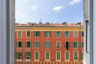 a view of a large building from a window at 5 FODERE - Magnifique Duplex - Port de Nice - Dernier etage in Nice