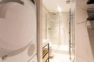 a bathroom with a shower and a sink at COSY VOLTI AP4434 By Riviera Holiday Homes in Villefranche-sur-Mer