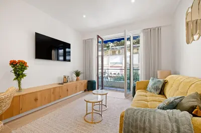 a living room with a couch and a tv at Massenet Dream,Nice in Nice