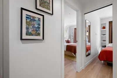a room with a mirror and a bedroom with a bed at Massenet Dream,Nice in Nice