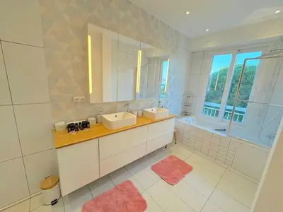 a white bathroom with two sinks and a mirror at ⁂ Luxueux 3 pièces 300m de la plage clim sauna in Nice