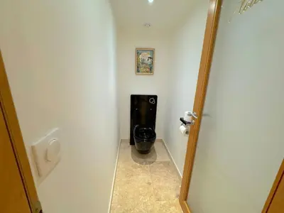 a bathroom with a toilet in the corner of a room at ⁂ Magnifique 3P cœur du Vieux Nice in Nice
