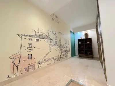 a room with a drawing on the wall at ⁂ Magnifique 3P cœur du Vieux Nice in Nice