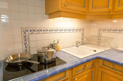 a kitchen with a sink and a stove top oven at Magnifique appartement vue mer Mont Borron in Nice