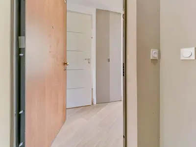 an empty room with a door and a hallway at Cosy duplex, hyper centre, wifi,air conditionner in Nice