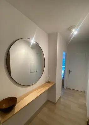 a large mirror on the wall of a room at Lovely studio apartment in Nice
