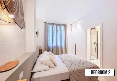a small bedroom with a bed with a mirror at Nestor&Jeeves - PALMIERS TERRASSE - Central - Terrace in Nice