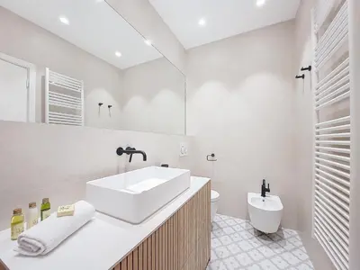 a white bathroom with a sink and a toilet at Nestor&Jeeves - PALMIERS TERRASSE - Central - Terrace in Nice