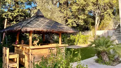 a table with a bottle of wine and glasses at Luxury Riviera Villa* short walk to beach & center in Cagnes-sur-Mer