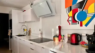 a kitchen with a white counter top in a room at Luxury Riviera Villa* short walk to beach & center in Cagnes-sur-Mer