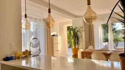 a kitchen and dining room with a table and chairs at Luxury Riviera Villa* short walk to beach & center in Cagnes-sur-Mer