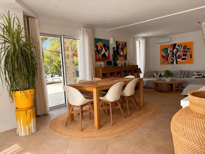 a living room with a book shelf filled with books at Luxury Riviera Villa* short walk to beach & center in Cagnes-sur-Mer