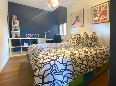 a bedroom with a large bed in a room at Appartement 2 chambres à 15 mn de la mer in Nice